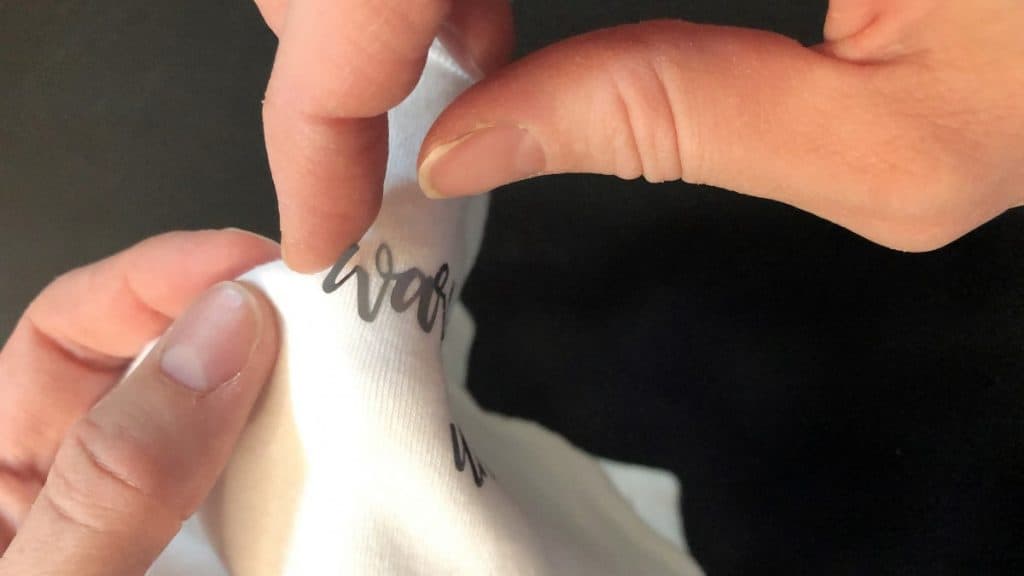 adhesive vinyl peeling off baby onsie shirt